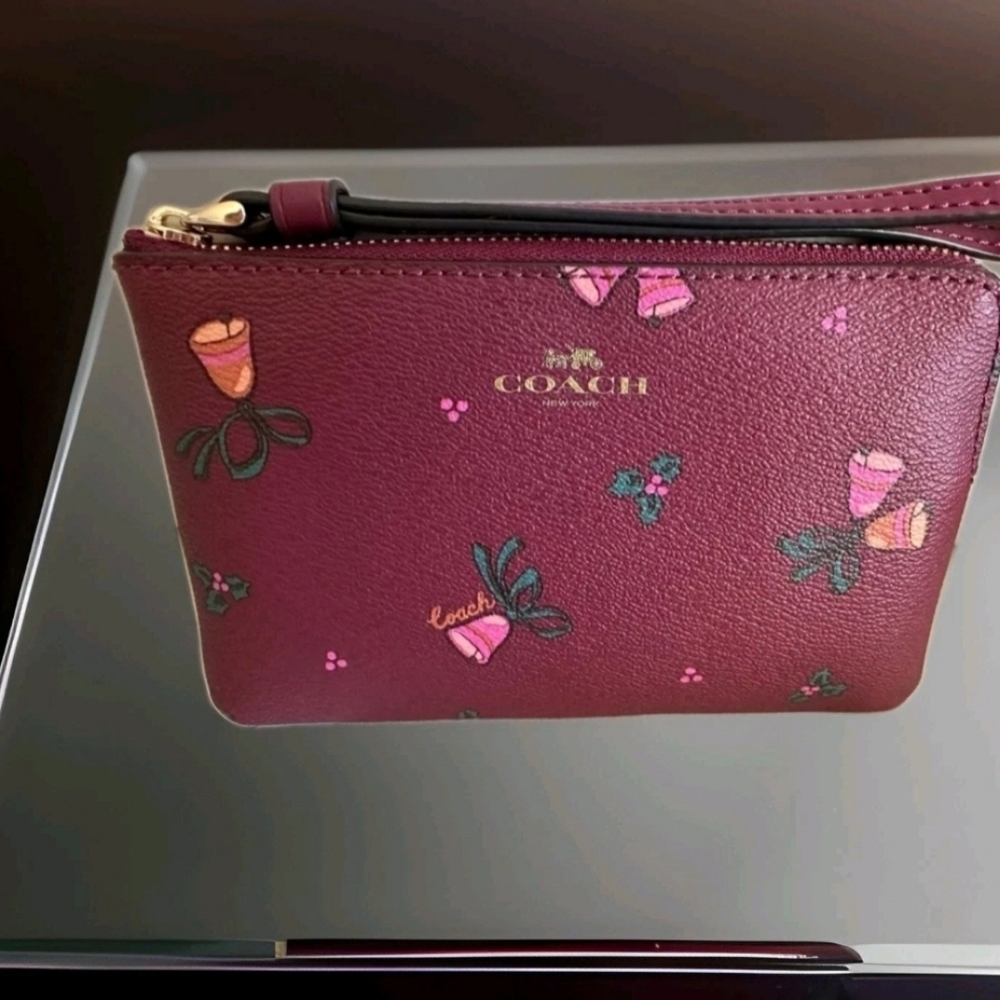 Pre-loved burgundy Coach Holiday Wristlet